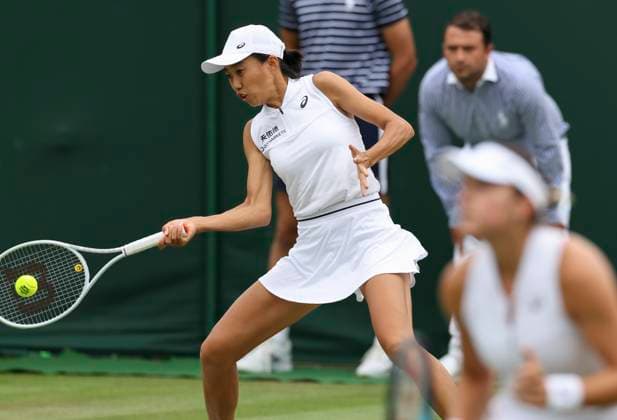 (230708) -- LONDON, July 8, 2023 -- Zhang Shuai (L) Caroline Dolehide compete during the women s doubles second round match between Hozumi Eri of Japan Rebeka Masarova of Spain and Zhang Shuai of China Caroline Dolehide of the United States at Wimbledon Tennis Championships in London, Britain, July 8, 2023. ) (SP)BRITAIN-LONDON-TENNIS-WIMBLEDON-DAY 6 HanxYan 