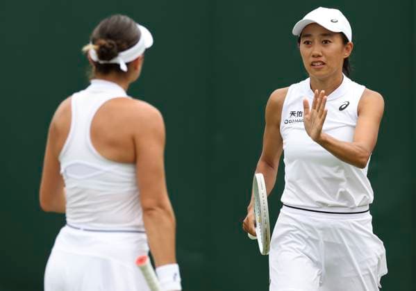 (230708) -- LONDON, July 8, 2023 -- Zhang Shuai (R) Caroline Dolehide celebrate scoring during the women s doubles second round match between Hozumi Eri of Japan Rebeka Masarova of Spain and Zhang Shuai of China Caroline Dolehide of the United States at Wimbledon Tennis Championships in London, Britain, July 8, 2023. ) (SP)BRITAIN-LONDON-TENNIS-WIMBLEDON-DAY 6 HanxYan 