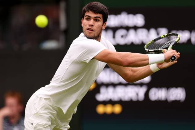 8th July 2023; All England Lawn Tennis and Croquet Club, London, England: Wimbledon Tennis Tournament; Carlos Alcaraz plays a backhand shot to Nicolas Jerry  ActionPlus12528671 ShaunxBrooks