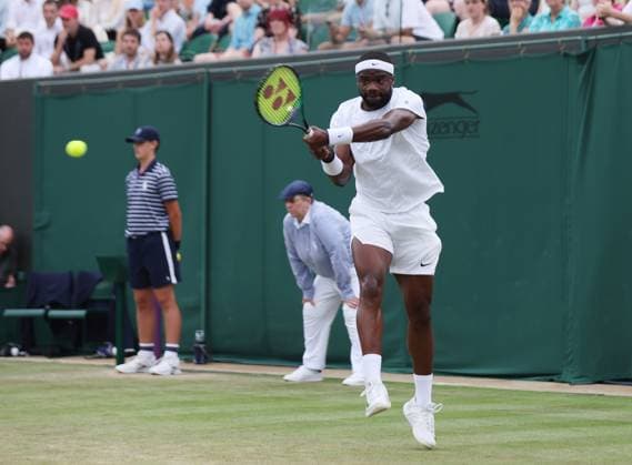 American Frances Tiafoe plays a backhand in his match against Bulgarian Gregor Dimitrov on day six of the 2023 Wimbledon championships in London on Saturday, July 08, 2023.  LON2023070861 HUGOxPHILPOTT