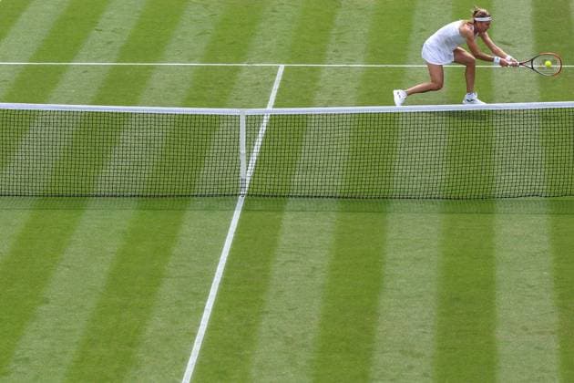 Wimbledon: Day Seven 9 July 2023, Wimbledon - Wimbledon Tennis Championships - Day Seven - Marie Bouzkova (CZE) stretches for the ball close to the net - Photo: Charlotte Wilson Offside. Wimbledon UK Copyright: xCharlottexWilsonx xOffsidexOffside