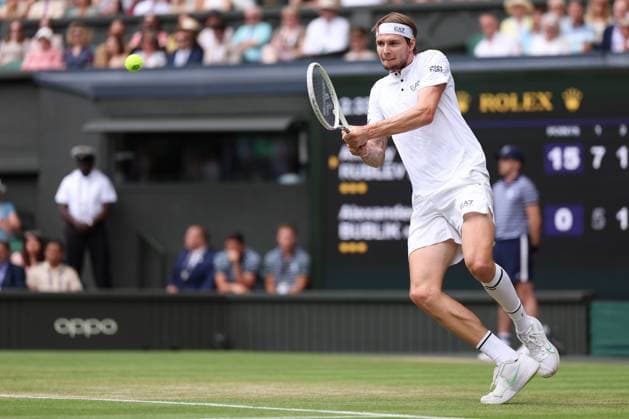 9th July 2023; All England Lawn Tennis and Croquet Club, London, England: Wimbledon Tennis Tournament; Alexander Bublik plays a backhand shot to Andrey Rublev  ActionPlus12529267 ShaunxBrooks