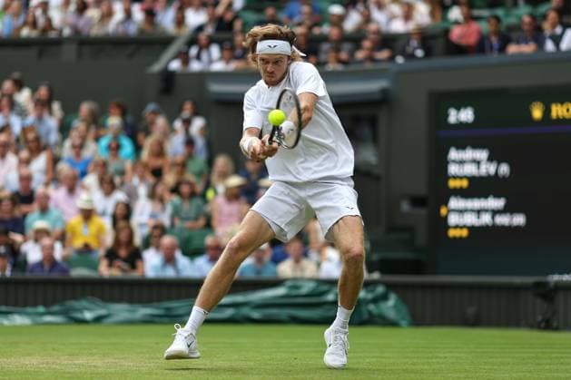 Wimbledon: Day Seven 9 July 2023, Wimbledon - Wimbledon Tennis Championships - Day Seven - Andrey Rublev returns the ball to Alexander Bublik with a two-handed backhand - Photo: Charlotte Wilson Offside. Wimbledon UK Copyright: xCharlottexWilsonx xOffsidexOffside