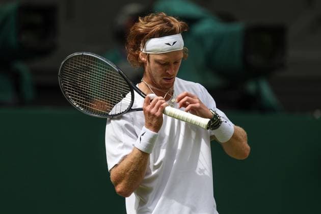 Wimbledon: Day Seven 9 July 2023, Wimbledon - Wimbledon Tennis Championships - Day Seven - Andrey Rublev untangles his necklaces - Photo: Charlotte Wilson Offside. Wimbledon UK Copyright: xCharlottexWilsonx xOffsidexOffside