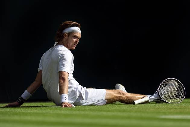Wimbledon: Day Seven 9 July 2023, Wimbledon - Wimbledon Tennis Championships - Day Seven - Andrey Rublev sits on the floor after diving for the ball - Photo: Charlotte Wilson Offside. Wimbledon UK Copyright: xCharlottexWilsonx xOffsidexOffside
