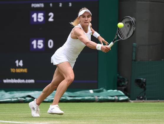 Ukraine s Lesia Tsurenko plays a backhand in her match against American Jessica Pegula on day seven of the 2023 Wimbledon championships in London on Sunday, July 9, 2023.  LON2023070921 HUGOxPHILPOTT