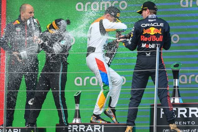 F1 Grand Prix of Great Britain Lewis Hamilton of Great Britain and Mercedes and Max Verstappen of Oracle Red Bull Racing spray Champagne over Lando Norris of Great Britain and McLaren on the podium during the Formula 1 Aramco British Grand Prix at Silverstone Circuit, Towcester, UK on Sunday 9th July 2023. United Kingdom  Copyright: xMIxNewsx originalFilename:fletcher-formula1230709_npjQR.jpg