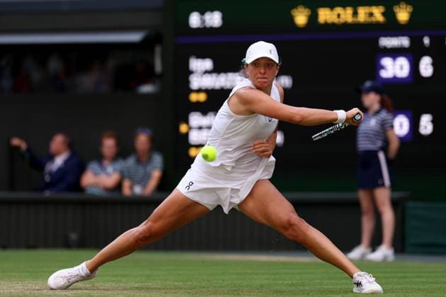 9th July 2023; All England Lawn Tennis and Croquet Club, London, England: Wimbledon Tennis Tournament; Iga Swiatek returns a forehand from Belinda Bencic  ActionPlus12529498 ShaunxBrooks