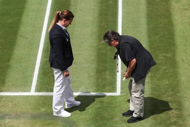 Wimbledon: Day Eight 10 July 2023, Wimbledon - Wimbledon Tennis Championships - Day Eight - Officials inspect the ground after Mirra Andreeva threw her racket to the ground, creating a small divot during her Ladies Singles round of 16 match against Madison Keys (USA) - Photo: Charlotte Wilson Offside. Wimbledon UK Copyright: xCharlottexWilsonx xOffsidexOffside