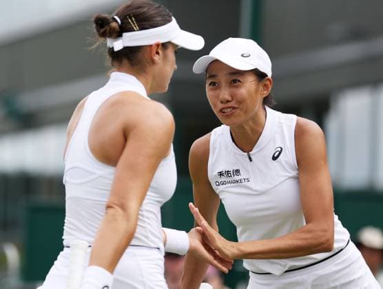 (230710) -- LONDON, July 10, 2023 -- Zhang Shuai (R) Caroline Dolehide celebrate during the women s doubles third round match between Zhu Lin of China Wu Fang-Hsien of Chinese Taipei and Zhang Shuai of China Caroline Dolehide of the United States at Wimbledon Tennis Championships in London, Britain, July 10, 2023. ) (SP)BRITAIN-LONDON-TENNIS-WIMBLEDON LixYing 