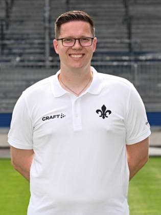 10.07.2023, xjhx, Fussball 1.Bundesliga, SV Darmstadt 98 - Fototermin Saison 2023 24 1.BL Porträttermin 2023 2024 emspor, v.l. Physiotherapeut David Ackermann; SV Darmstadt 98; 1.BL, Porträttermin 2023 2024 (DFL DFB REGULATIONS PROHIBIT ANY USE OF PHOTOGRAPHS as IMAGE SEQUENCES and or QUASI-VIDEO) Darmstadt