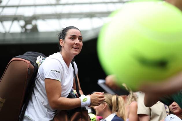 Wimbledon: Day Eight 10 July 2023, Wimbledon - Wimbledon Tennis Championships - Day Eight - Ons Jabeur (TUN) signs large tennis balls after her Ladies Singles Round of 16 match victory against Petra Kvitova (CZE) - Photo: Charlotte Wilson Offside. Wimbledon UK Copyright: xCharlottexWilsonx xOffsidexOffside