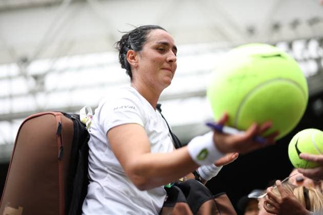 Wimbledon: Day Eight 10 July 2023, Wimbledon - Wimbledon Tennis Championships - Day Eight - Ons Jabeur (TUN) signs large tennis balls after her Ladies Singles Round of 16 match victory against Petra Kvitova (CZE) - Photo: Charlotte Wilson Offside. Wimbledon UK Copyright: xCharlottexWilsonx xOffsidexOffside
