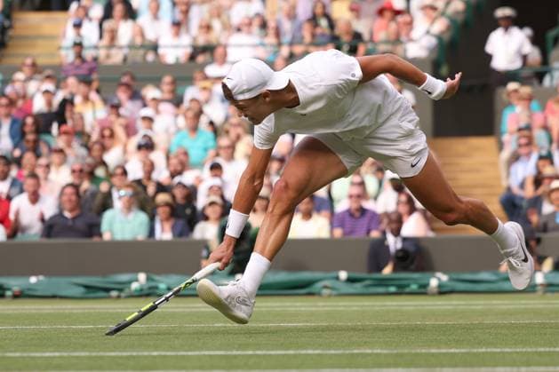 10th July 2023; All England Lawn Tennis and Croquet Club, London, England: Wimbledon Tennis Tournament; Holger Rune sprints to the ball during his match with Grigor Dimitrov  ActionPlus12529982 ShaunxBrooks