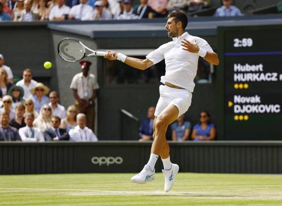 Tennis: Wimbledon championships Novak Djokovic of Serbia plays against Hubert Hurkacz of Poland in the men s singles fourth round at the Wimbledon tennis tournament in London on July 10, 2023, following the postponement of the match the previous day due to Wimbledon s 11 p.m. curfew.  A14AA0001669945P  