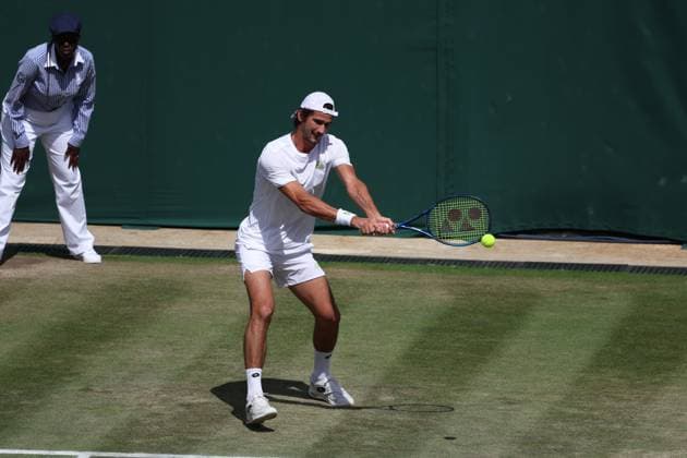 11th July 2023; All England Lawn Tennis and Croquet Club, London, England: Wimbledon Tennis Tournament; Lloyd Harris (RSA) with a forehand shot to Horacio Zeballos (ARG) mens doubles round of 16  ActionPlus12530071 JohnxPatrickxFletcher