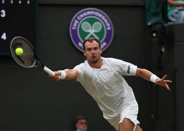 11th July 2023; All England Lawn Tennis and Croquet Club, London, England: Wimbledon Tennis Tournament; Roman Safiullin (RUS) with a forehand shot to Jannik Sinner (ITA)  ActionPlus12530276 JohnxPatrickxFletcher