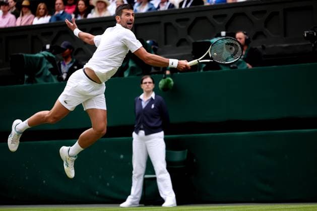 11th July 2023; All England Lawn Tennis and Croquet Club, London, England: Wimbledon Tennis Tournament; Novak Djokovic jumps in the air to return a forehand from Andrey Rublev in mens quarter-finals singles  ActionPlus12530417 ShaunxBrooks