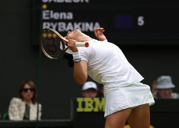 12th July 2023; All England Lawn Tennis and Croquet Club, London, England: Wimbledon Tennis Tournament; Ons Jabeur (TUN) reacts disappointed after her forehand shot hits the net and concedes another game to Elena Rybakina (KAZ)  ActionPlus12530636 JohnxPatrickxFletcher