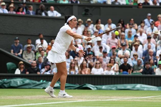 Wimbledon: Day Ten 12 July 2023, Wimbledon - Wimbledon Tennis Championships - Day Ten - Ons Jabeur (TUN) hits the ball into the ground out of frustration during her Ladies Singles Quarter Finals match against Elena Rybakina (KAZ) - Photo: Charlotte Wilson Offside. Wimbledon UK Copyright: xCharlottexWilsonx xOffsidexOffside