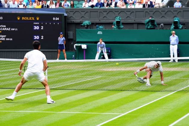 Mandatory Credit: Photo by Javier Garcia Shutterstock (14006839et) Carlos Alcaraz and Holger Rune during their quarter final match Wimbledon Tennis Championships, Day 10, The All England Lawn Tennis and Croquet Club, London, UK - 12 Jul 2023 Wimbledon Tennis Championships, Day 10, The All England Lawn Tennis and Croquet Club, London, UK - 12 Jul 2023  Copyright: xJavierxGarcia Shutterstockx 14006839et