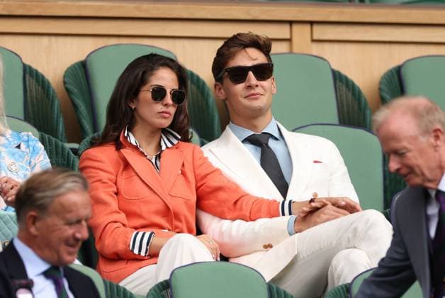 12th July 2023; All England Lawn Tennis and Croquet Club, London, England: Wimbledon Tennis Tournament; F1 driver George Russell with girlfriend attends the match between Carlos Alcaraz v Holger Rune on Centre Court  ActionPlus12530674 ShaunxBrooks