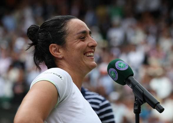 12th July 2023; All England Lawn Tennis and Croquet Club, London, England: Wimbledon Tennis Tournament; Ons Jabeur (TUN) all smiles after defeating the defending champion Elena Rybakina (KAZ) by two sets to one  ActionPlus12530693 JohnxPatrickxFletcher