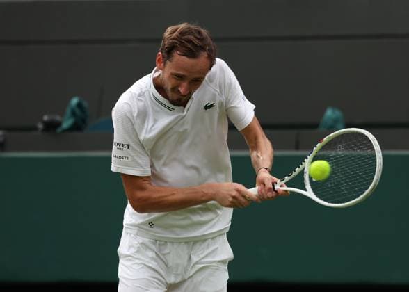 12th July 2023; All England Lawn Tennis and Croquet Club, London, England: Wimbledon Tennis Tournament; Daniil& xa0;Medvedev (RUS) with a backhand shot to Christopher& xa0;Eubanks (USA)  ActionPlus12530777 JohnxPatrickxFletcher