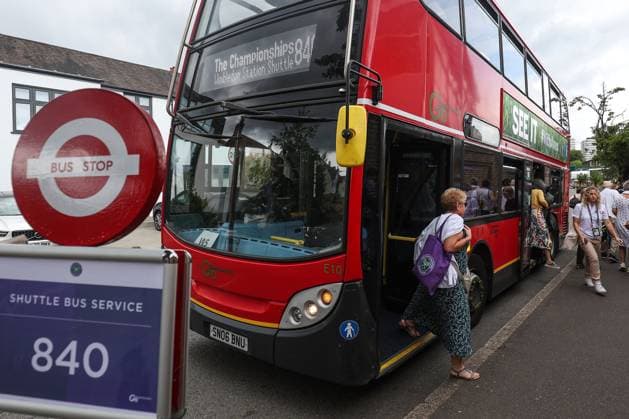 Wimbledon: Day Eleven 13 July 2023, Wimbledon - Wimbledon Tennis Championships - Day Eleven - Spectators disembark from the Wimbledon shuttle bus - Photo: Charlotte Wilson Offside. Wimbledon UK Copyright: xCharlottexWilsonx xOffsidexOffside