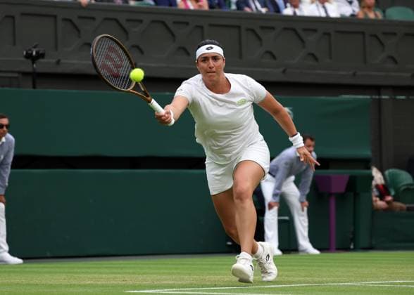 13th July 2023; All England Lawn Tennis and Croquet Club, London, England: Wimbledon Tennis Tournament; Ons Jabeur (TUN) with a forehand shot to Aryna Sabalenka (BLR)  ActionPlus12531101 JohnxPatrickxFletcher