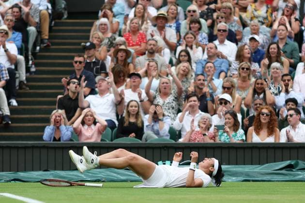 Wimbledon: Day Eleven 13 July 2023, Wimbledon - Wimbledon Tennis Championships - Day Eleven - Ons Jabeur (TUN) drops to the ground after a tiring game during her Ladies Singles Semi Finals match against Aryna Sabalenka - Photo: Charlotte Wilson Offside. Wimbledon UK Copyright: xCharlottexWilsonx xOffsidexOffside