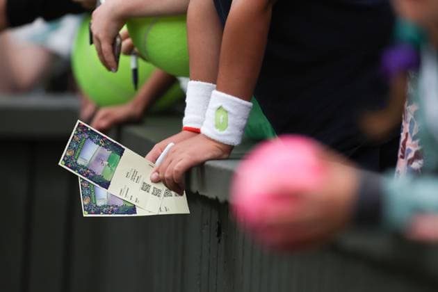 Wimbledon: Day Eleven 13 July 2023, Wimbledon - Wimbledon Tennis Championships - Day Eleven - A fan holds two tickets - Photo: Charlotte Wilson Offside. Wimbledon UK Copyright: xCharlottexWilsonx xOffsidexOffside