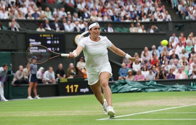 Tunisian Ons Jabeur plays a forehand in her Women s semifinals match against Belarussian Aryna Sabalenka at the 2023 Wimbledon championships in London on Thurssday, July 13, 2023. Jabeur won the match 6-7,6-4,6-3.  LON2023071334 HUGOxPHILPOTT
