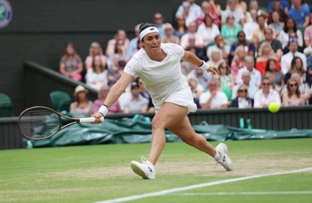 Tunisian Ons Jabeur plays a forehand in her Women s semifinals match against Belarussian Aryna Sabalenka at the 2023 Wimbledon championships in London on Thurssday, July 13, 2023. Jabeur won the match 6-7,6-4,6-3.  LON2023071355 HUGOxPHILPOTT