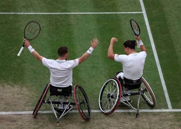 13th July 2023; All England Lawn Tennis and Croquet Club, London, England: Wimbledon Tennis Tournament; Alfie Hewett (GBR) and Gordon Reid (GBR) celebrate after defeating Martin De La Puente (ESP) and Gustavo Fernandez (ARG) in wheelchair tennis, in two sets to make the tournament final  ActionPlus12531121 JohnxPatrickxFletcher