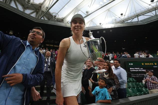 13th July 2023; All England Lawn Tennis and Croquet Club, London, England: Wimbledon Tennis Tournament; Lyudmyla Kichenok poses with the Mixed Doubles Trophy  ActionPlus12531184 JohnxPatrickxFletcher