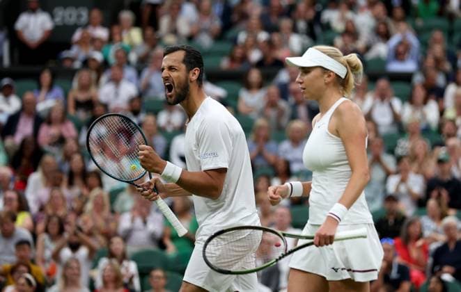 (230714) -- LONDON, July 14, 2023 -- Mate Pavic (L) Lyudmyla Kichenok react during the mixed doubles final match between Xu Yifan of China Joran Vliegen of Belgium and Mate Pavic of Croatia Lyudmyla Kichenok of Ukraine at Wimbledon tennis Championship in London, Britain, on July 13, 2023. ) (SP)BRITAIN-LONDON-TENNIS-WIMBLEDON-DAY 11 LixYing 