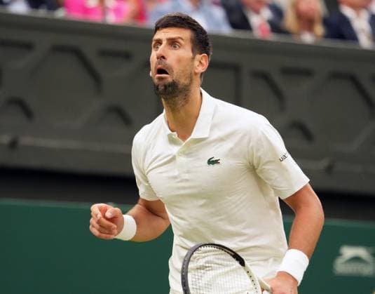 Tennis - 2023 Wimbledon Championships - Week Two - Day Twelve - All England lawn Tennis & Racquet Club, Wimbledon - Friday 14th Mens Semi final - Novak Djokovic v Jannik Sinner Novak Djokovic taunts the crowd after some started booing him 