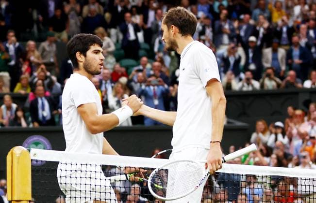 Mandatory Credit: Photo by Kieran McManus Shutterstock (14009604fp) Carlos Alcaraz of Spain and Daniil Medvedev of Russia shake hands after their Semi Final match. Wimbledon Tennis Championships, Day 12, The All England Lawn Tennis and Croquet Club, London, UK - 14 Jul 2023 Wimbledon Tennis Championships, Day 12, The All England Lawn Tennis and Croquet Club, London, UK - 14 Jul 2023  Copyright: xKieranxMcManus Shutterstockx 14009604fp