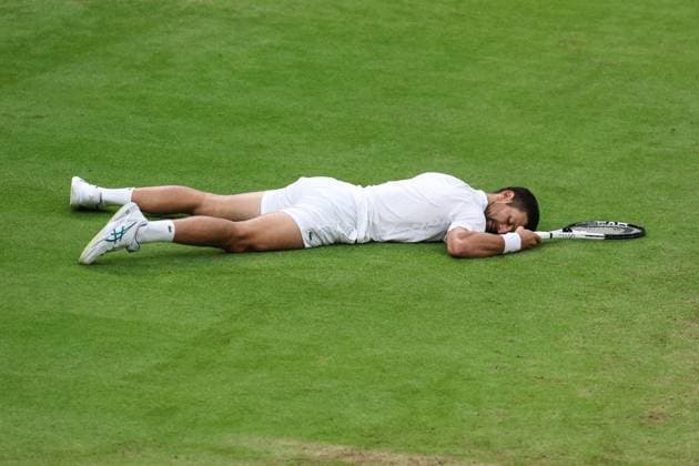 Wimbledon: Day Twelve 14 July 2023, Wimbledon - Wimbledon Tennis Championships - Day Twelve - Novak Djokovic (SRB) lies on the ground after slipping - Photo: Charlotte Wilson Offside. Wimbledon UK Copyright: xCharlottexWilsonx xOffsidexOffside