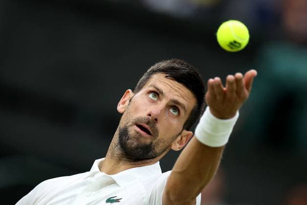 (230715) -- LONDON, July 15, 2023 -- Novak Djokovic serves during the men s singles semifinal between Novak Djokovic of Serbia and Jannik Sinner of Italy at Wimbledon tennis Championship in London, Britain, on July 14, 2023. ) (SP)BRITAIN-LONDON-TENNIS-WIMBLEDON-DAY 12 LixYing 
