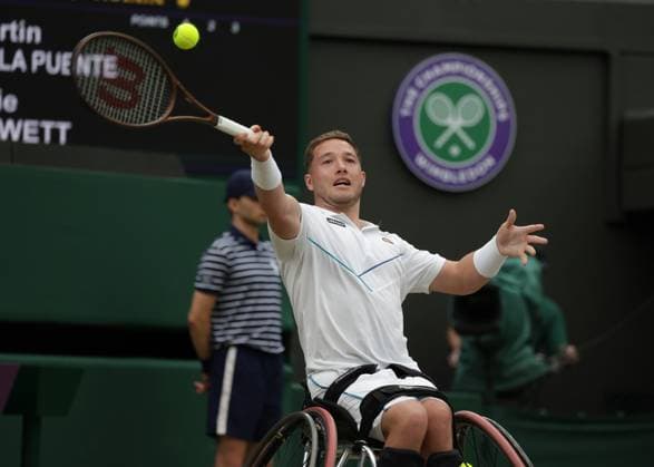 15th July 2023; All England Lawn Tennis and Croquet Club, London, England: Wimbledon Tennis Tournament; Alfie& xa0;Hewett (GBR) with a forehand shot to De La Puente (ESP) , mens wheelchair singles semi-final  ActionPlus12531398 JohnxPatrickxFletcher