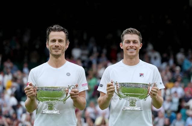 (230716) -- LONDON, July 16, 2023 -- Wesley Koolhof (L) Neal Skupski pose for photos during the awarding ceremony after the men s doubles final match between Wesley Koolhof of the Netherlands Neal Skupski of Britain and Marcel Granollers of Spain Horacio Zeballos of Argentina at Wimbledon tennis Championship in London, Britain, on July 15, 2023. ) (SP)BRITAIN-LONDON-TENNIS-WIMBLEDON-MEN S DOUBLES-FINAL LixYing 