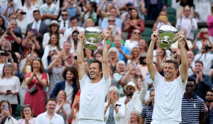 (230716) -- LONDON, July 16, 2023 -- Wesley Koolhof (L) Neal Skupski celebrate during the awarding ceremony after the men s doubles final match between Wesley Koolhof of the Netherlands Neal Skupski of Britain and Marcel Granollers of Spain Horacio Zeballos of Argentina at Wimbledon tennis Championship in London, Britain, on July 15, 2023. ) (SP)BRITAIN-LONDON-TENNIS-WIMBLEDON-MEN S DOUBLES-FINAL LixYing 