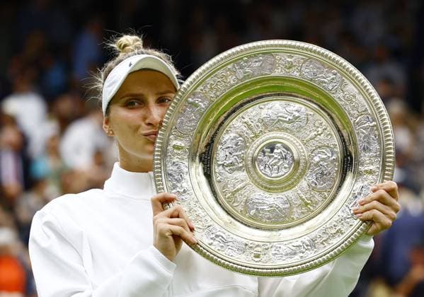 Tennis: Wimbledon championships Marketa Vondrousova of the Czech Republic kisses the victor s trophy after beating Ons Jabeur of Tunisia in the women s singles final at the Wimbledon tennis tournament in London on July 15, 2023.  A14AA0001684840P  
