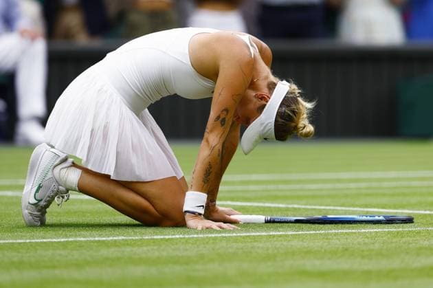 Tennis: Wimbledon championships Marketa Vondrousova of the Czech Republic drops to her knees after beating Ons Jabeur of Tunisia in the women s singles final at the Wimbledon tennis tournament in London on July 15, 2023.  A14AA0001684842P  