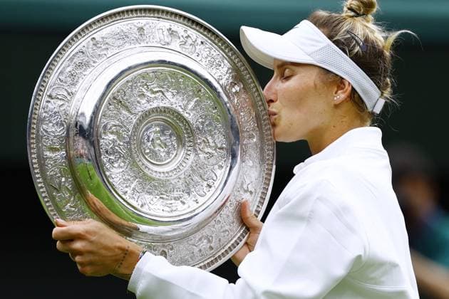 Tennis: Wimbledon championships Marketa Vondrousova of the Czech Republic kisses the victor s trophy after beating Ons Jabeur of Tunisia in the women s singles final at the Wimbledon tennis tournament in London on July 15, 2023.  A14AA0001684843P  