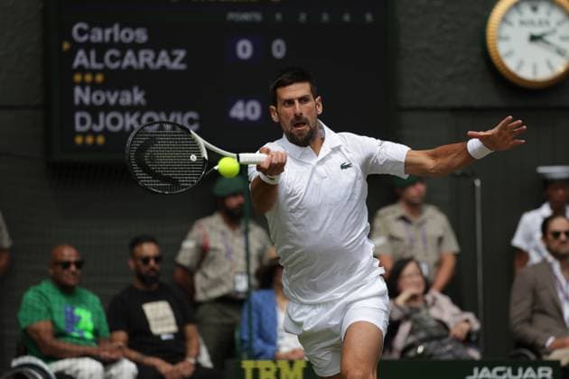 16th July 2023; All England Lawn Tennis and Croquet Club, London, England: Wimbledon Tennis Tournament; Mens singles final on centre court: Novak Djokovic returns to Carlos Alcaraz early in 1st set  ActionPlus12531937 JohnxPatrickxFletcher
