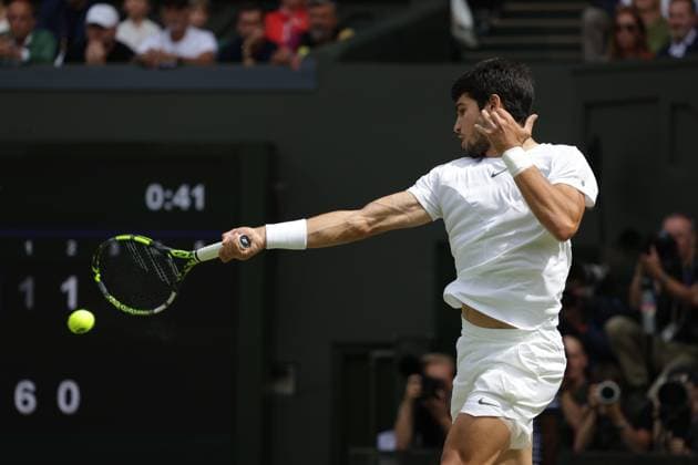 16th July 2023; All England Lawn Tennis and Croquet Club, London, England: Wimbledon Tennis Tournament; Mens singles final on centre court Novak Djokovic versus Carlos Alcaraz; Alcaraz returns  ActionPlus12531986 JohnxPatrickxFletcher