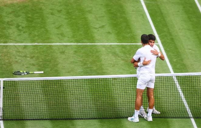 Mandatory Credit: Photo by Kieran McManus Shutterstock (14011306dh) Carlos Alcaraz wins the Mens Singles Championship at Wimbledon Beating Novak Djokovic as they hug at the net Wimbledon Tennis Championships, Day 14, The All England Lawn Tennis and Croquet Club, London, UK - 16 Jul 2023 Wimbledon Tennis Championships, Day 14, The All England Lawn Tennis and Croquet Club, London, UK - 16 Jul 2023  Copyright: xKieranxMcManus Shutterstockx 14011306dh
